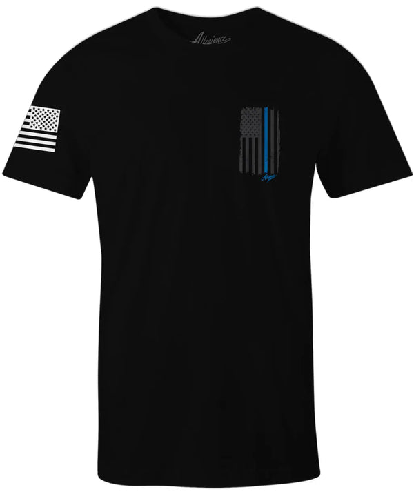 Front of Back the Blue Back Hit Tee in black featuring small Thin Blue Line flag on left chest and American flag on the sleeve.