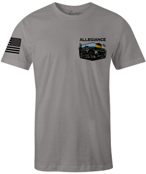 Front of Baja Premium Tee in gray featuring small desert off-road truck graphic with American flag and Allegiance logo on the chest.